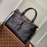 Replica Louis Vuitton Trianon bag in monogram empreinte leather, held by a woman, high-quality designer dupe with free shipping (9)