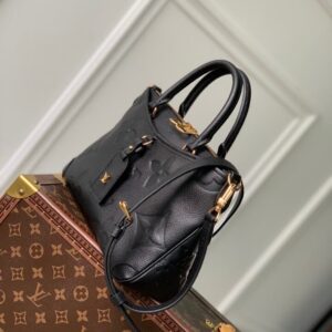 Replica Louis Vuitton Trianon bag in monogram empreinte leather, held by a woman, high-quality designer dupe with free shipping (9)