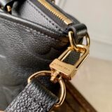 Replica Louis Vuitton Trianon bag in monogram empreinte leather, held by a woman, high-quality designer dupe with free shipping (9)