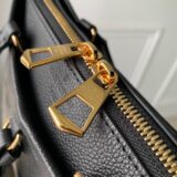 Replica Louis Vuitton Trianon bag in monogram empreinte leather, held by a woman, high-quality designer dupe with free shipping (9)