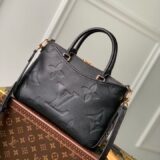 Replica Louis Vuitton Trianon bag in monogram empreinte leather, held by a woman, high-quality designer dupe with free shipping (9)