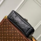 Replica Louis Vuitton Trianon bag in monogram empreinte leather, held by a woman, high-quality designer dupe with free shipping (9)